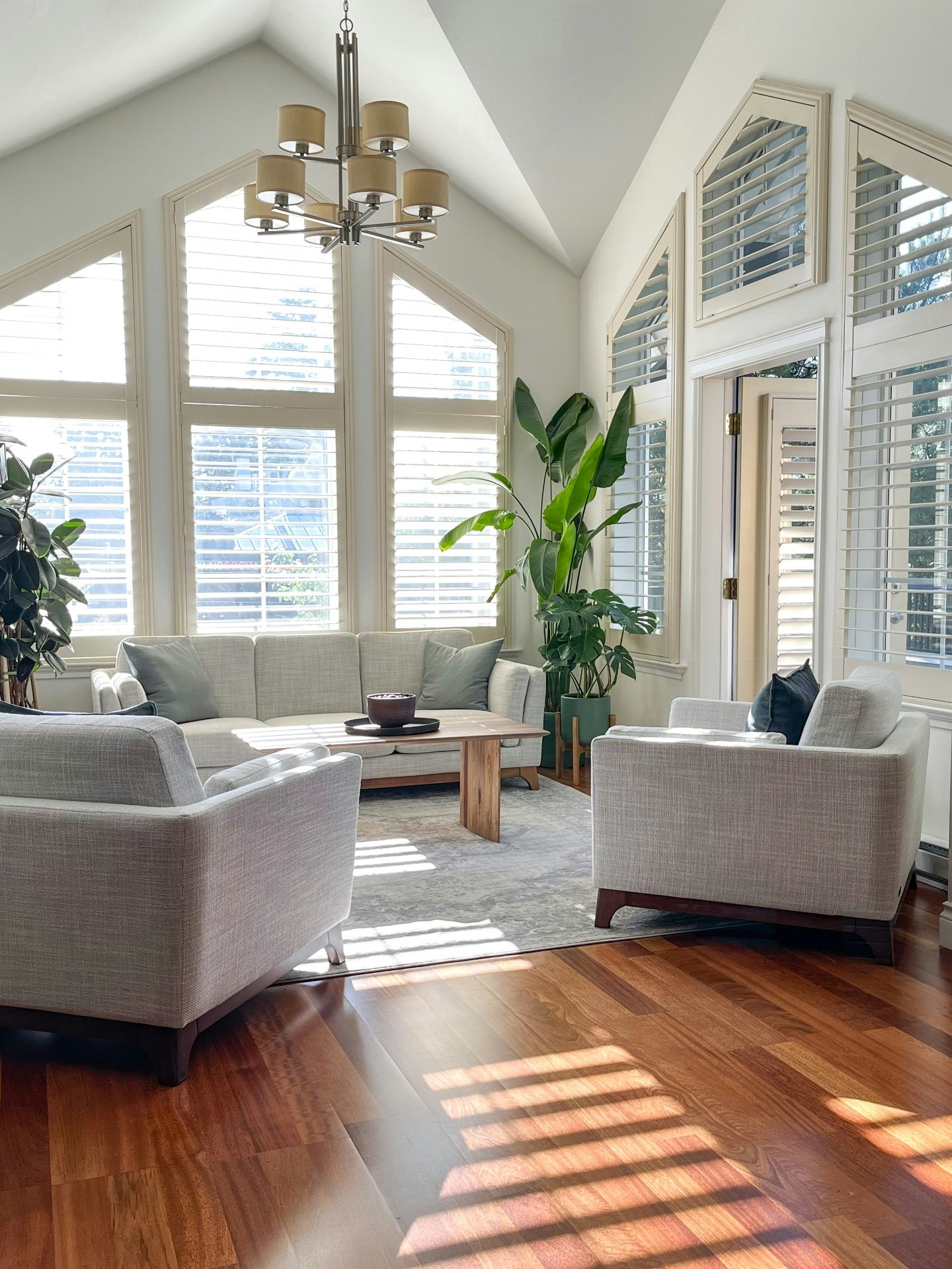 Modern living room with wide-plank hardwood flooring